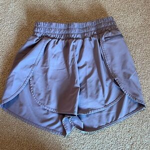 Mauve color high waisted athletic shorts with lining and side pocket